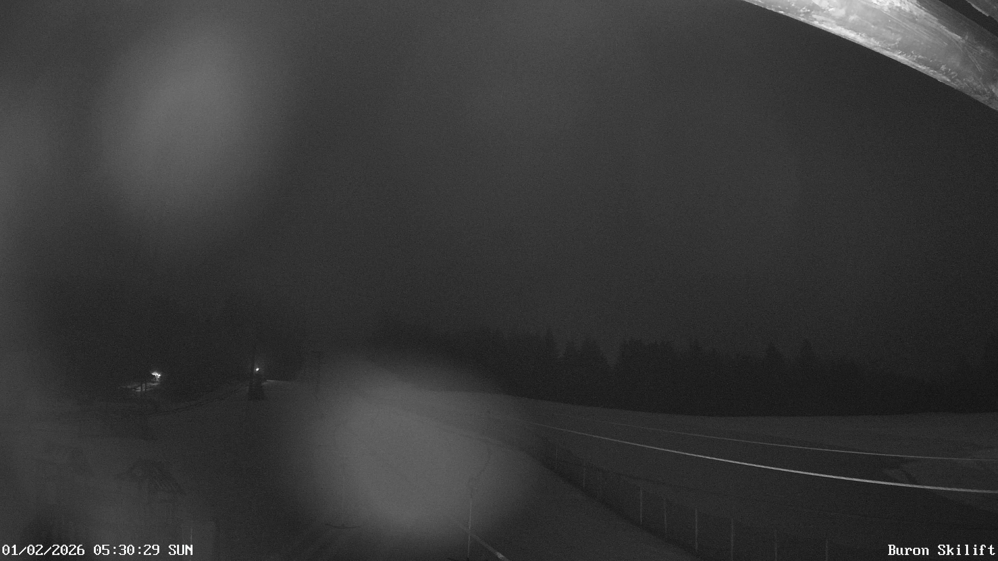 Archiv Foto Webcam Blick von der Talstation des Schlepplifts Buron auf den Lift und die Piste