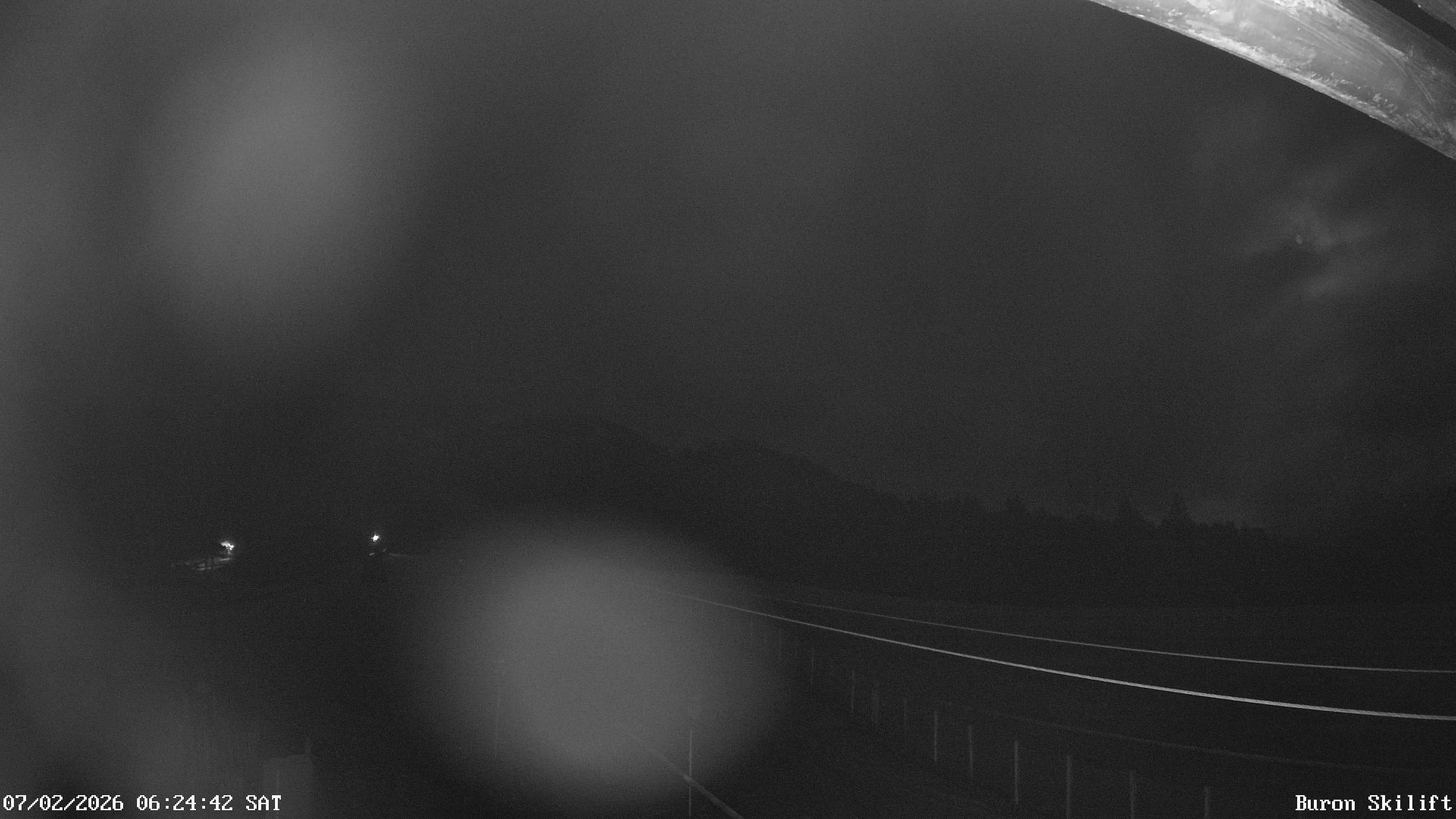 Archiv Foto Webcam Blick von der Talstation des Schlepplifts Buron auf den Lift und die Piste