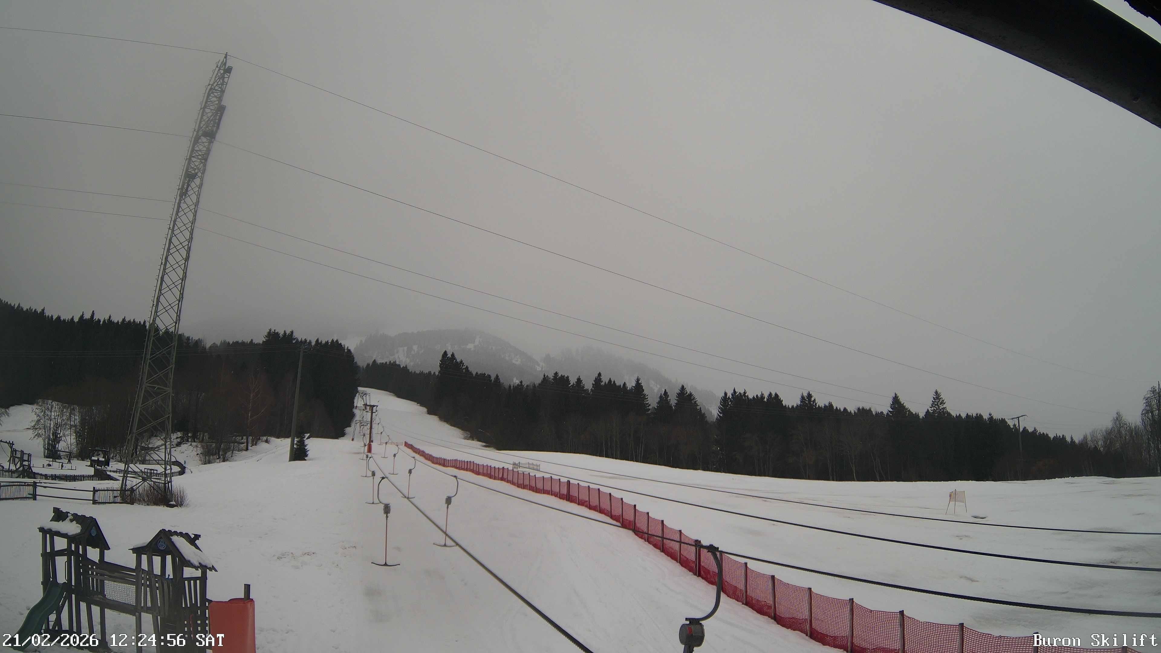 Archiv Foto Webcam Blick von der Talstation des Schlepplifts Buron auf den Lift und die Piste