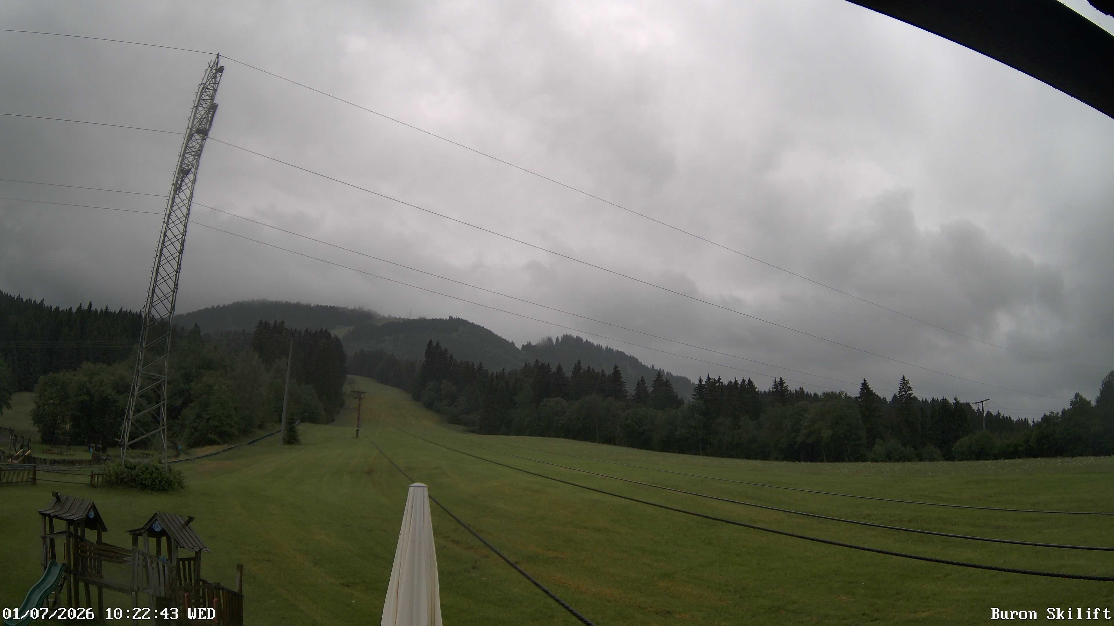 Archived image Webcam Enjoy the panoama view of the ski trail and lift in Buron