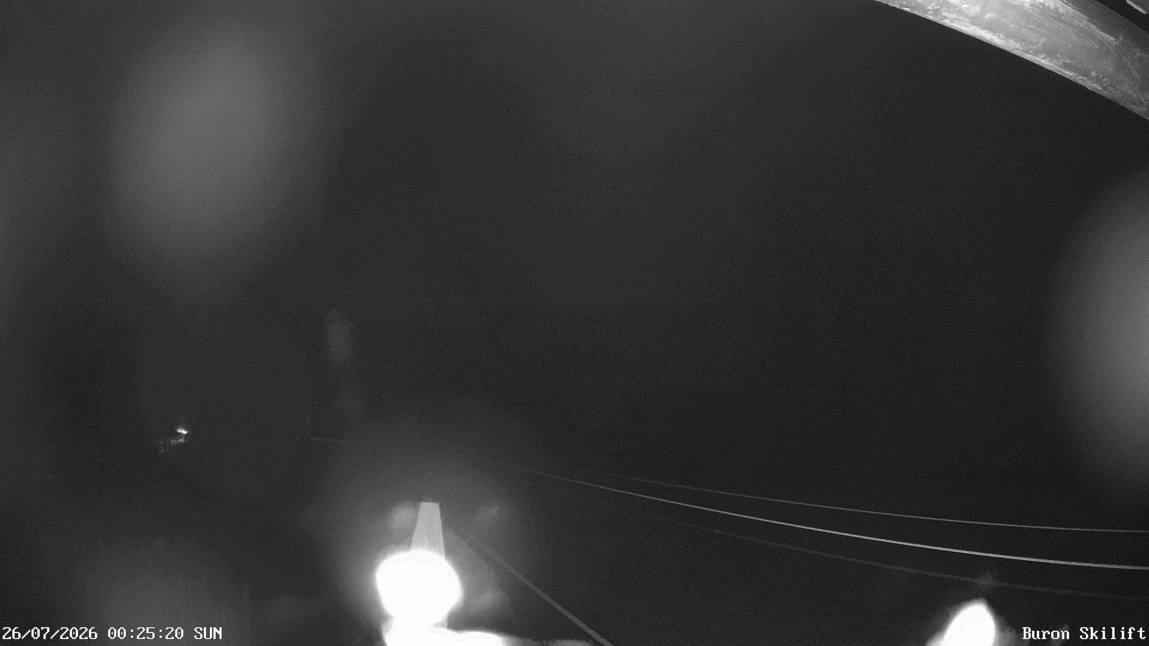 Archiv Foto Webcam Blick von der Talstation des Schlepplifts Buron auf den Lift und die Piste