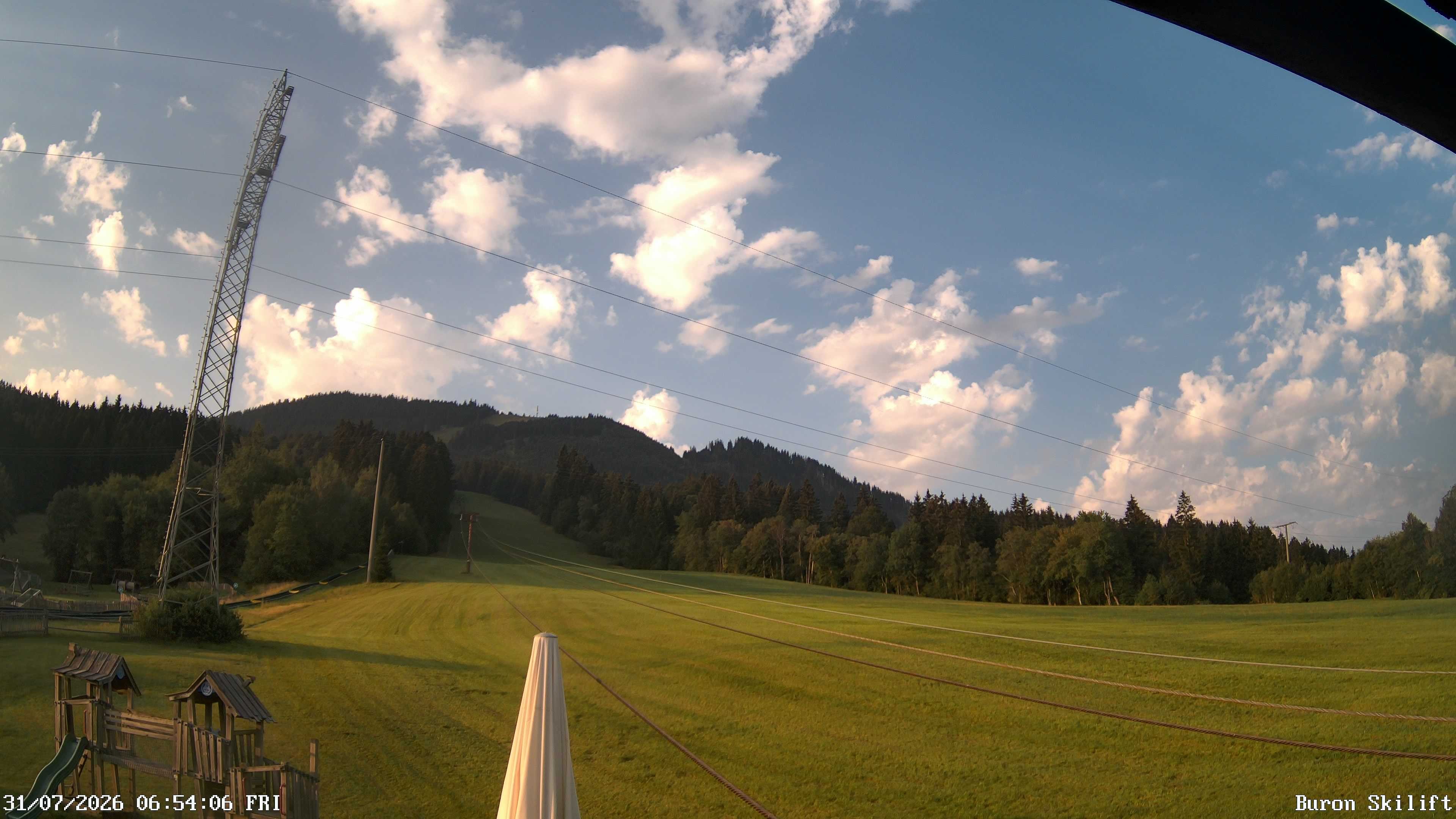 Archived image Webcam Enjoy the panoama view of the ski trail and lift in Buron