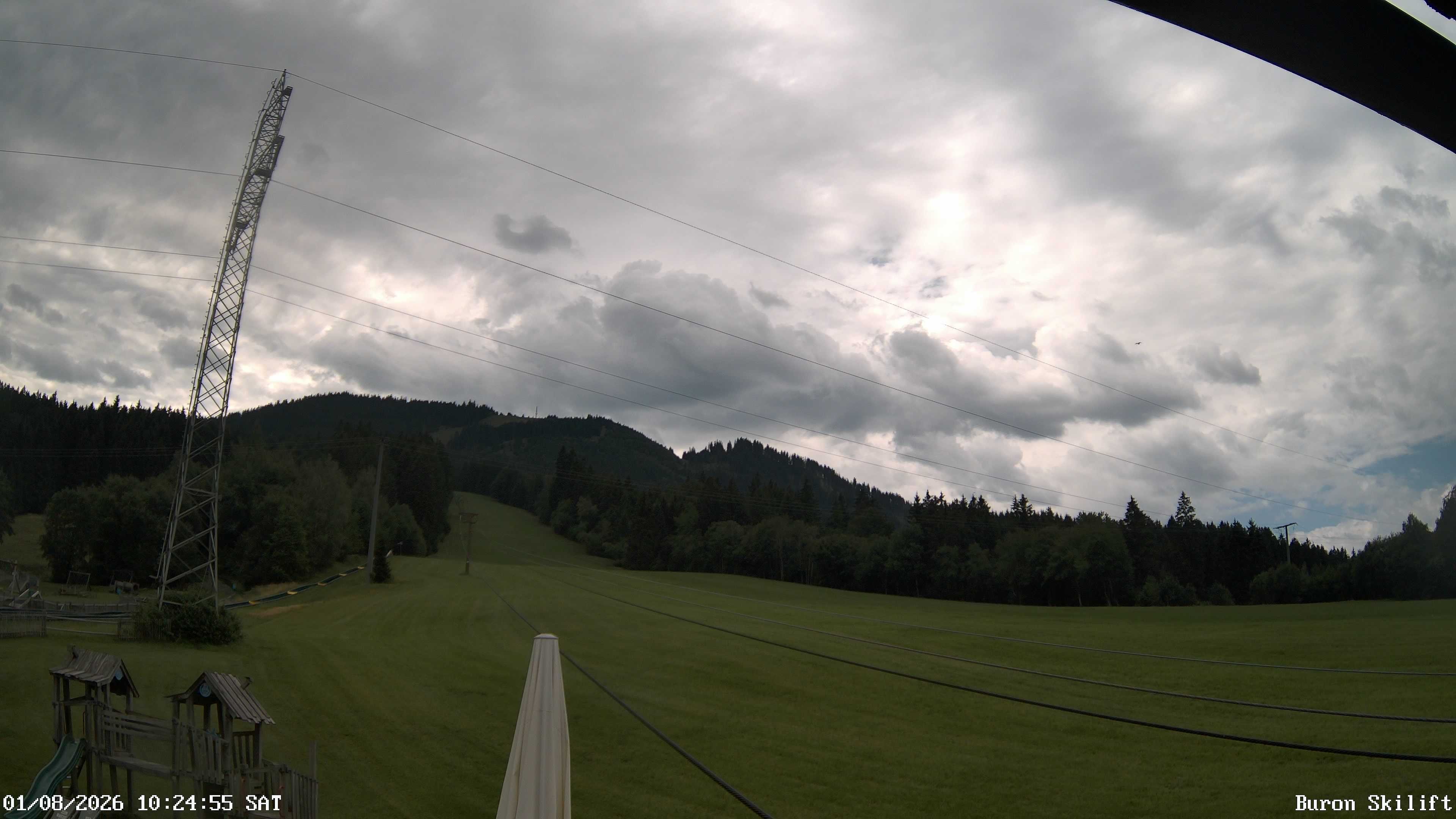 Archiv Foto Webcam Blick von der Talstation des Schlepplifts Buron auf den Lift und die Piste