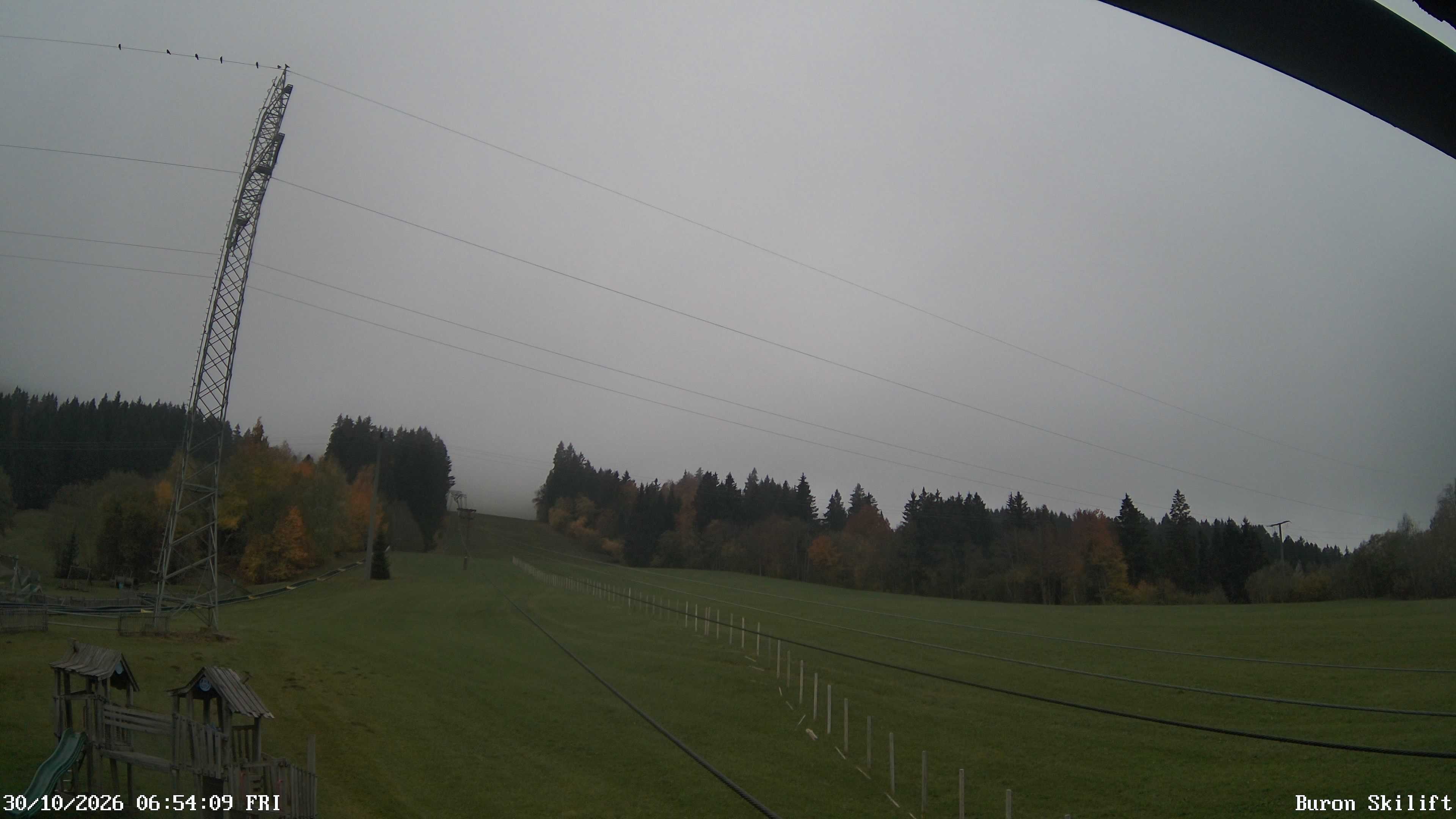 Archiv Foto Webcam Blick von der Talstation des Schlepplifts Buron auf den Lift und die Piste